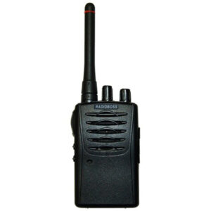 A black walkie talkie is on the side of the road.