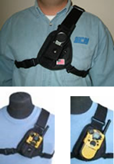 A man wearing a chest holster with a walkie talkie in it.
