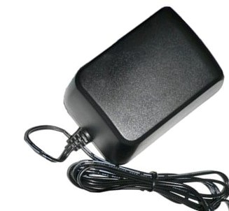 A black power cord is attached to the back of a charger.