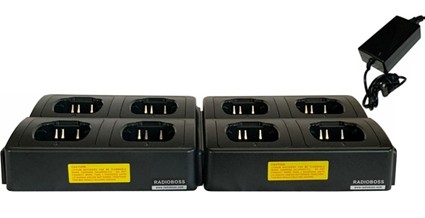 A group of four batteries sitting on top of each other.