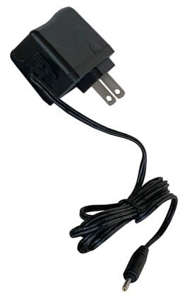 A black charger is plugged into the wall.
