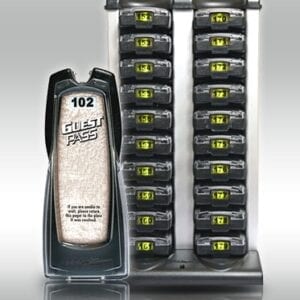 A large display of batteries in front of a cell phone.