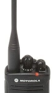 A black walkie talkie is on top of a table.