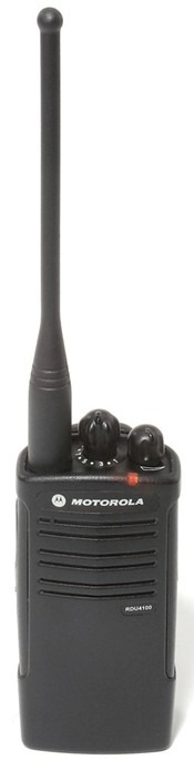 A black walkie talkie is on top of a table.