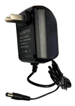 A black power cord is plugged into the wall.