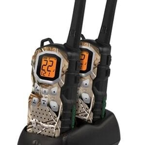 A pair of walkie talkies sitting on top of a black holder.