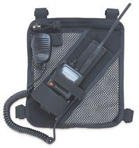 A radio is sitting in the mesh pocket of a bag.