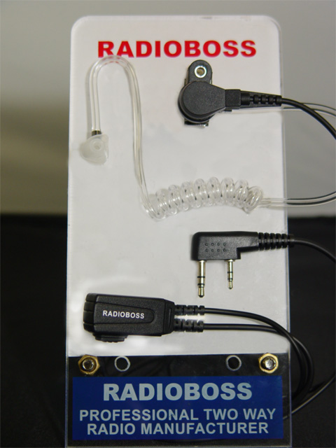 A radio boss display with some different types of earpieces.
