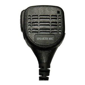 A black microphone is on the side of a white wall.