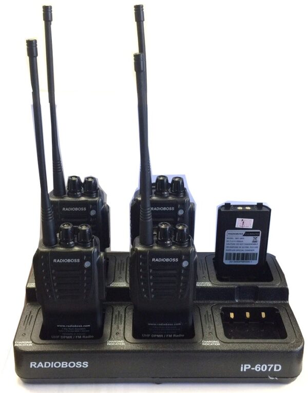 A group of walkie talkies sitting on top of a table.